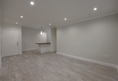 the living room and kitchen are empty and ready for us to move in