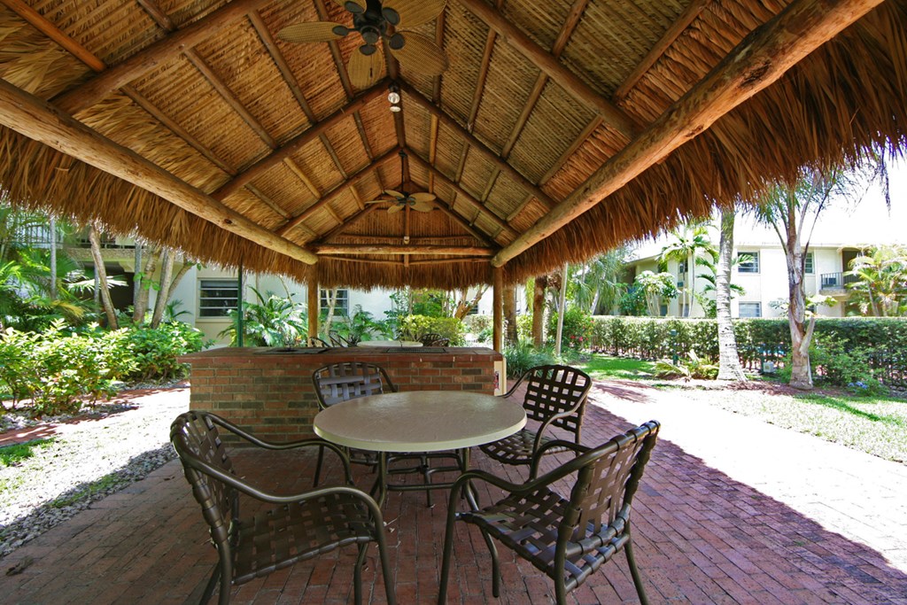 a patio with a table and chairs