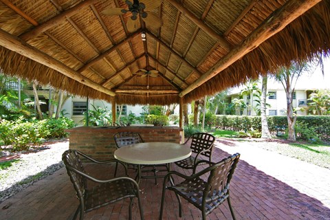 a patio with a table and chairs