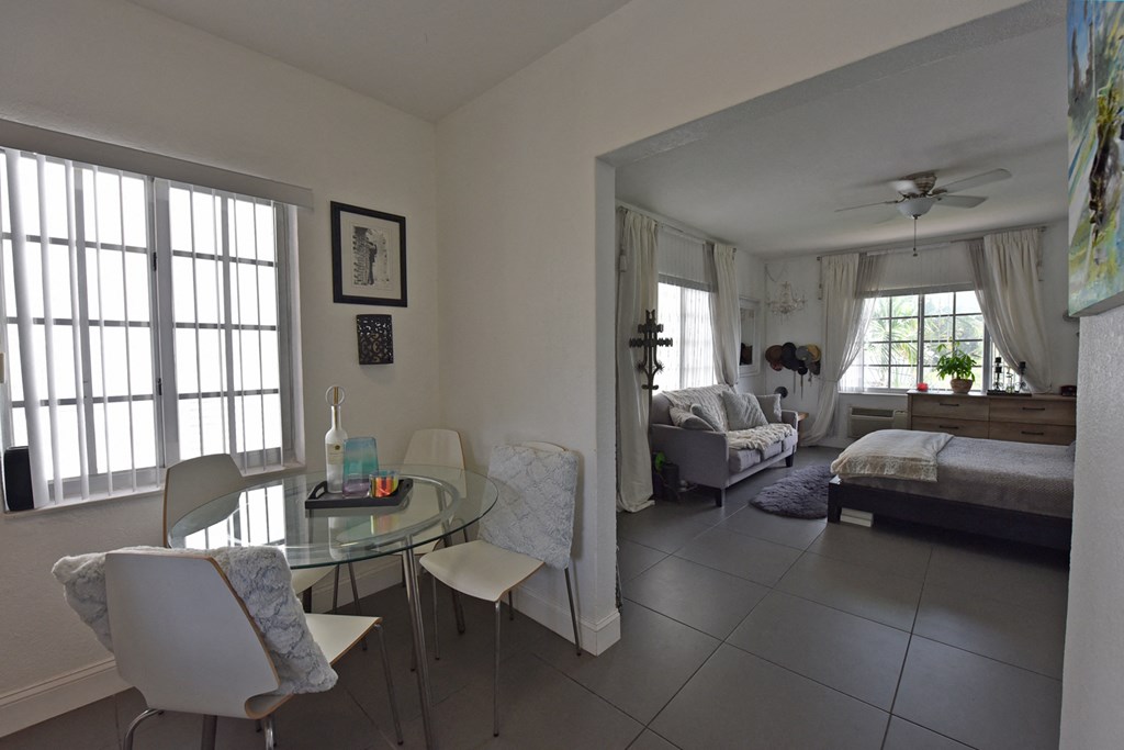 a view of the living room and bedroom from the dining room