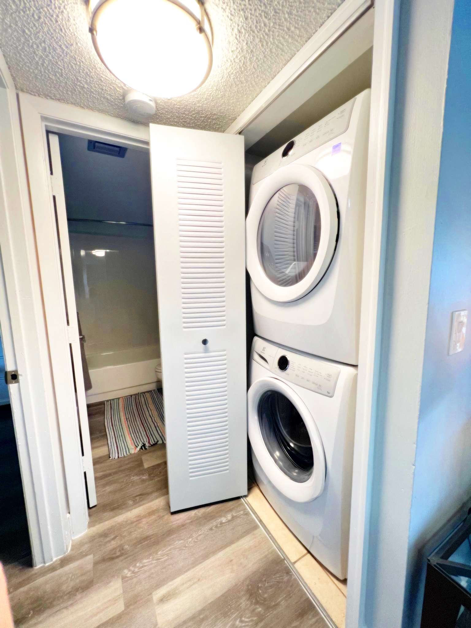 a small laundry room with a washing machine and a dryer