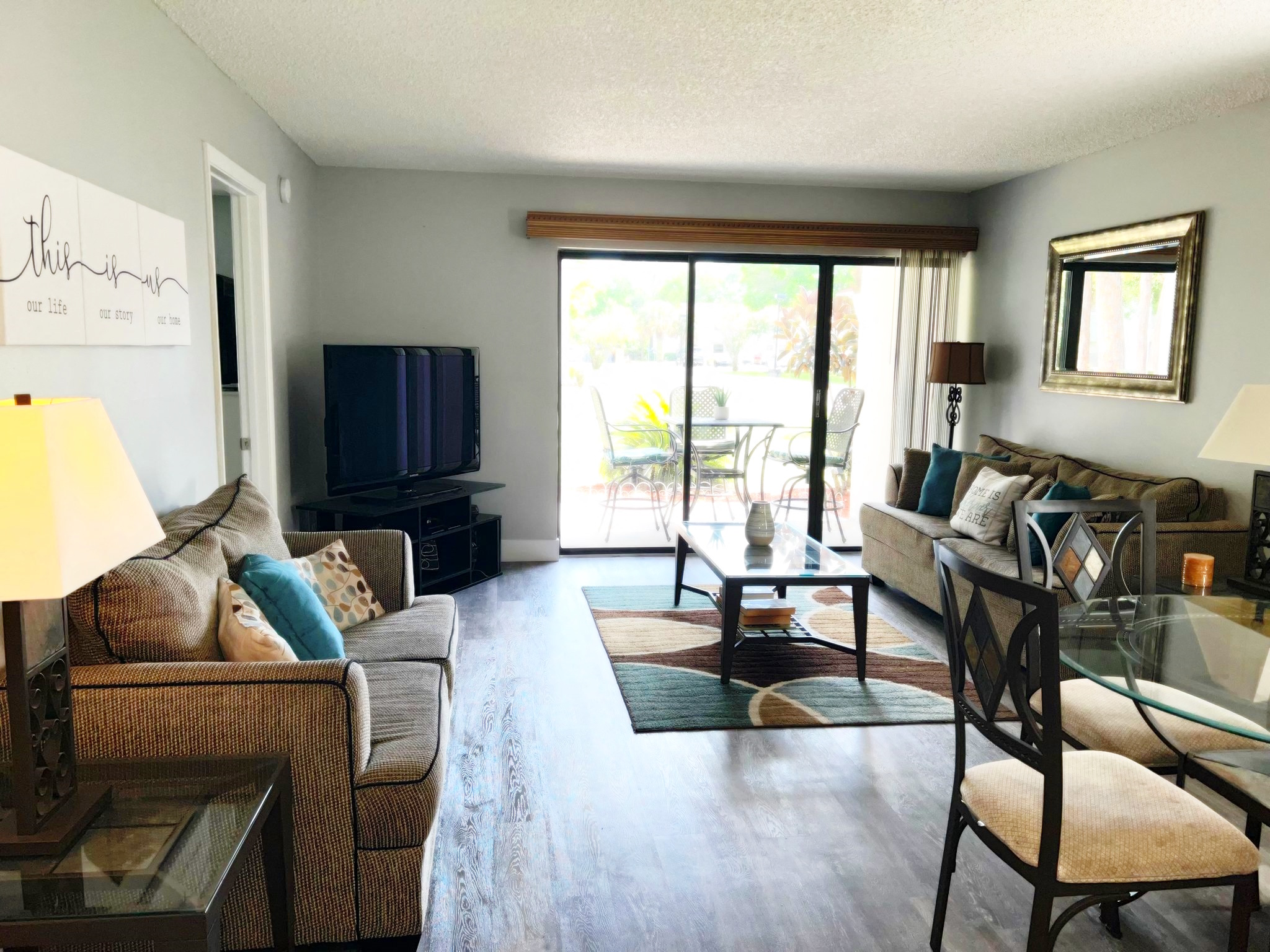 a living room with a couch and a tv