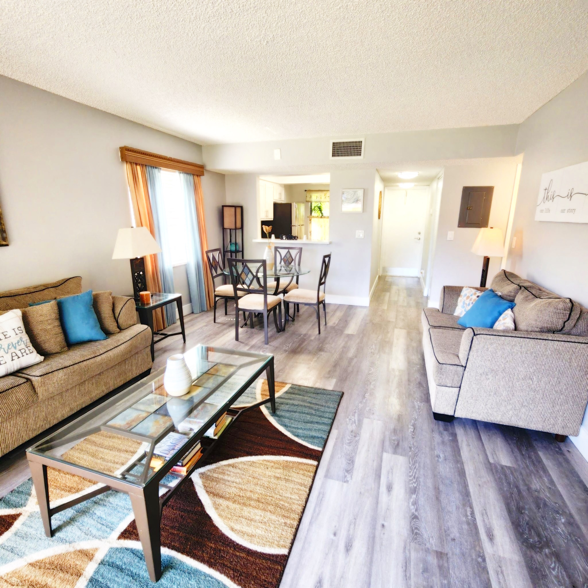 a living room with a couch and a table