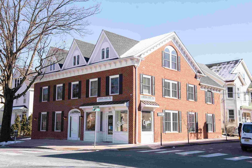 a red brick building on the corner of a street