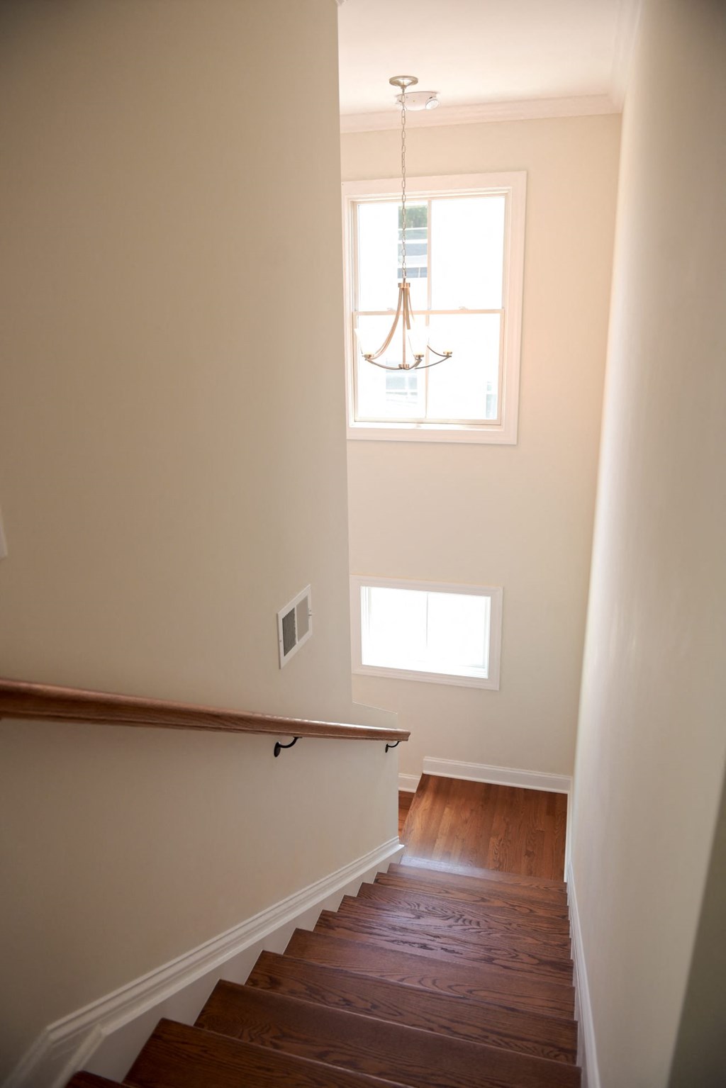 a view of a staircase and a window in a house