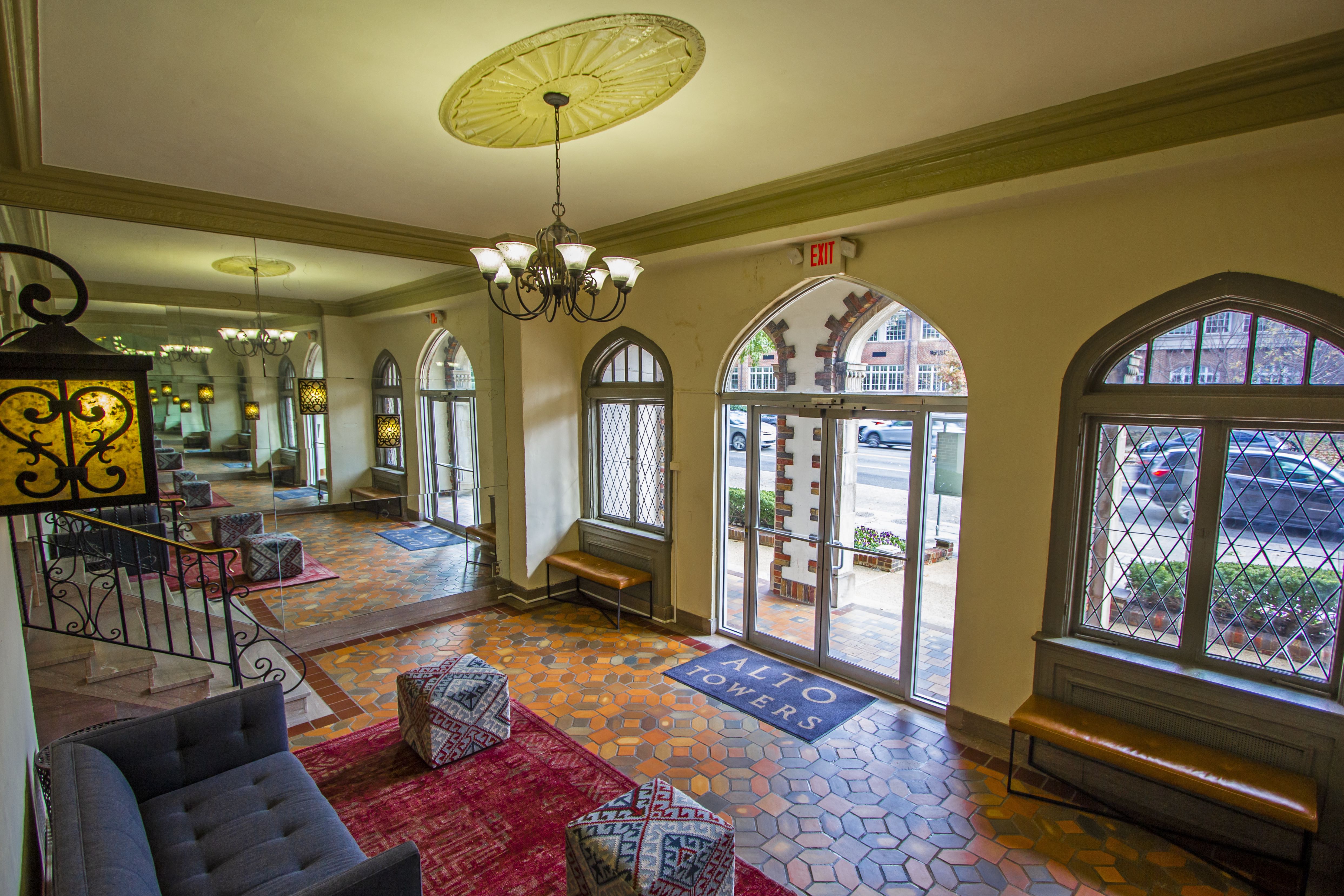 a view of the lobby of a building with large windows