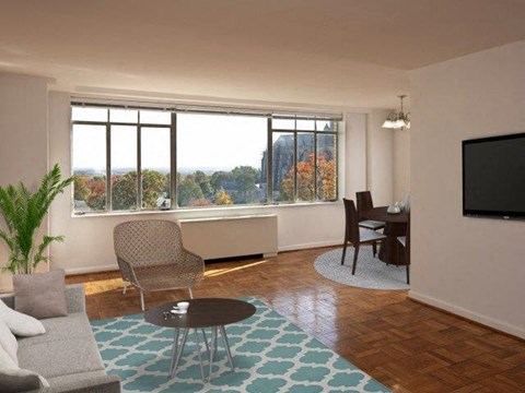 a living room with a couch and a table and a television