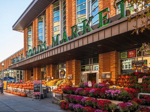 a grocery store with a display of fruit and vegetables