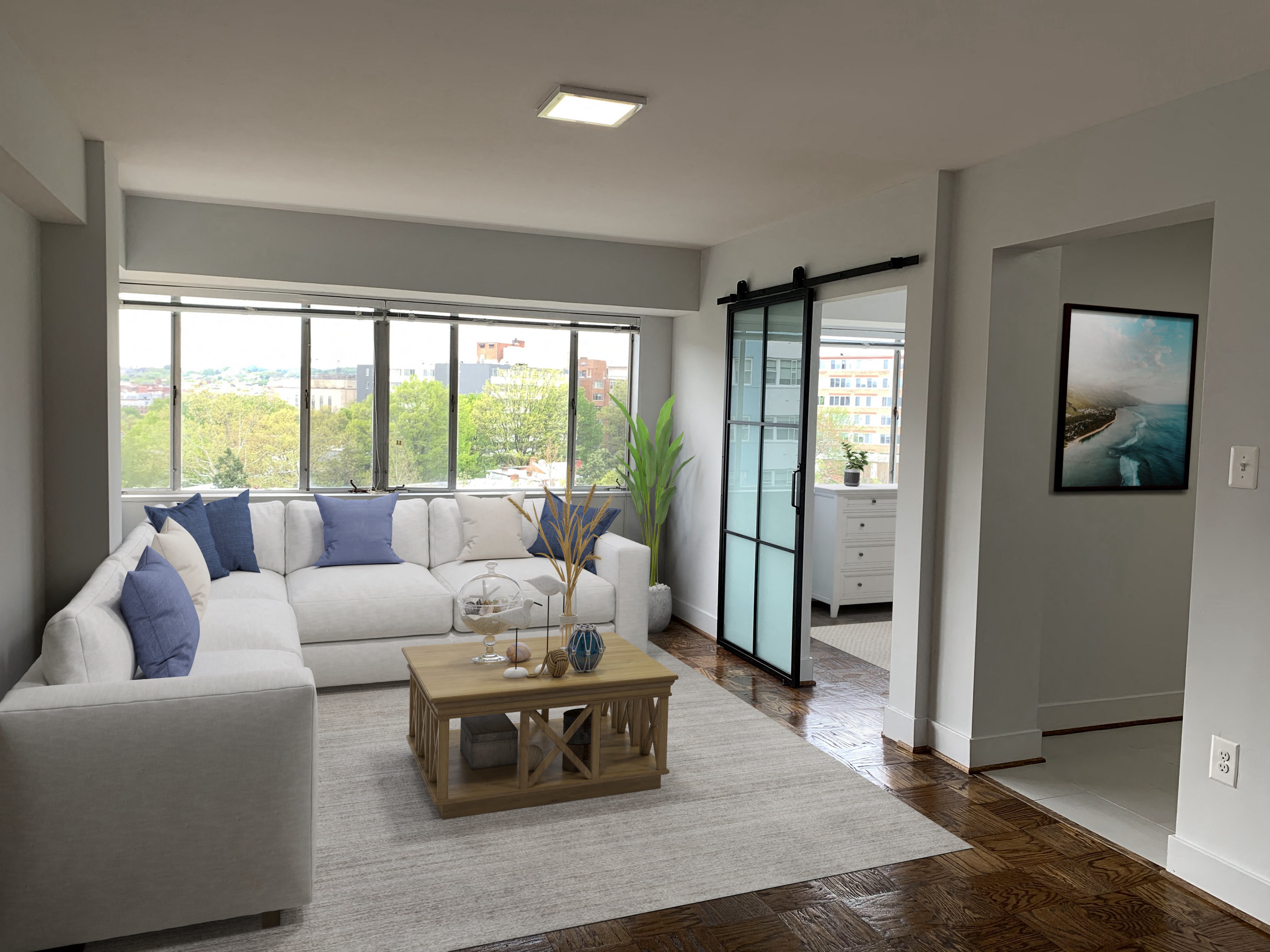 a living room with a white couch and a coffee table