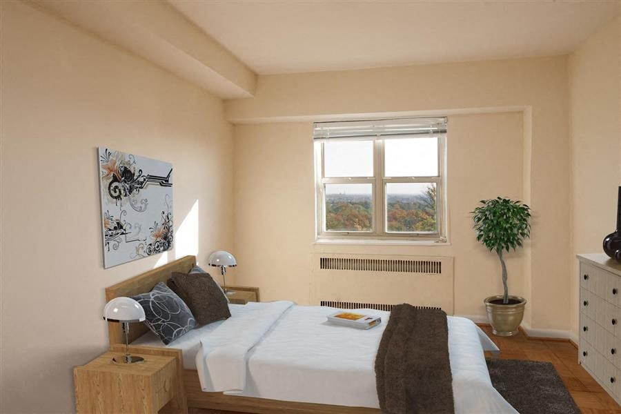 a bedroom with a bed and a window