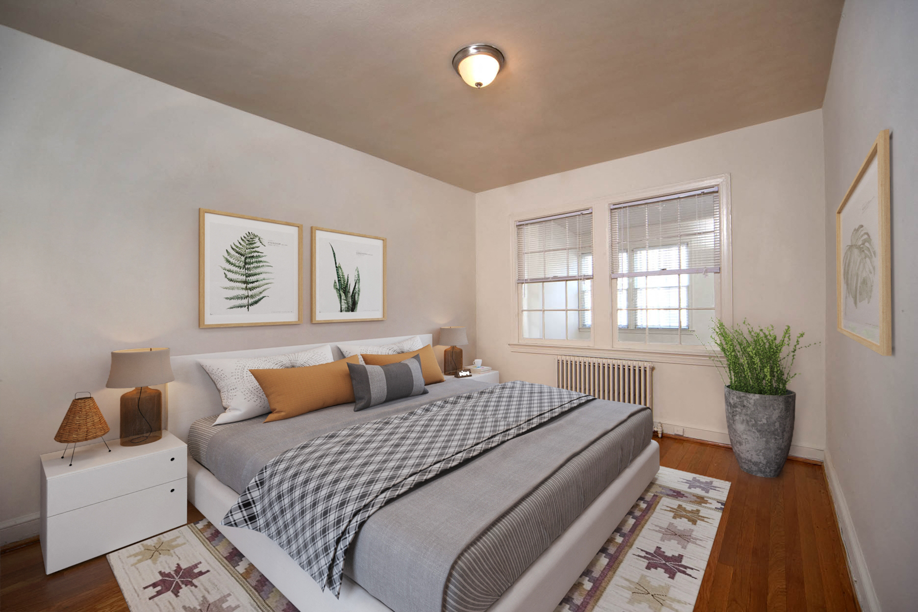 a bedroom with a bed and two windows