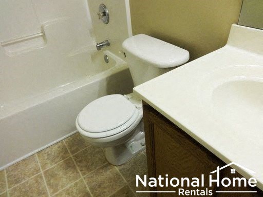 a bathroom with a toilet and a sink