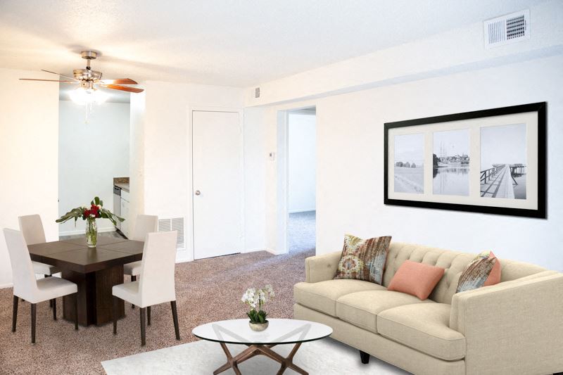 a living room and dining room with a couch and a table