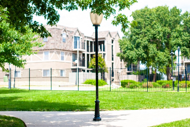 a lamp post in front of an apartment building