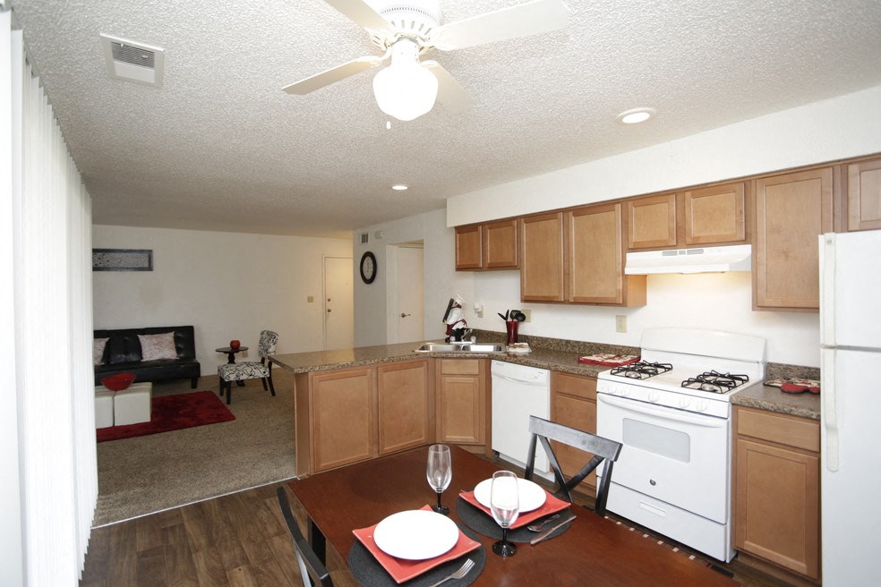a view of a kitchen and living room with a dining table