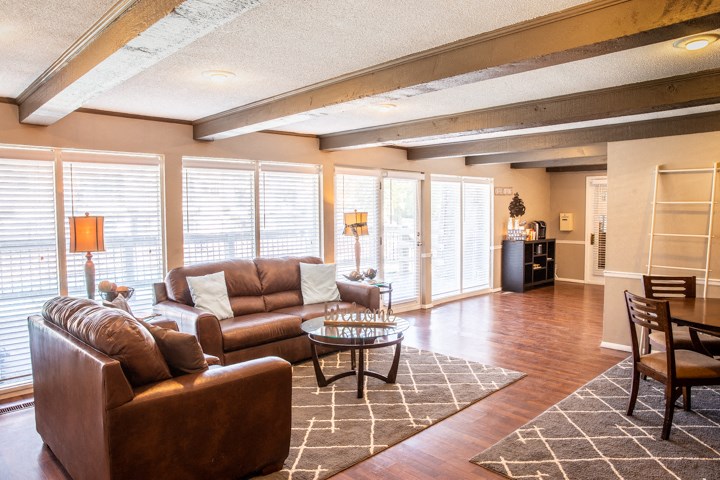 a living room with couches and a coffee table