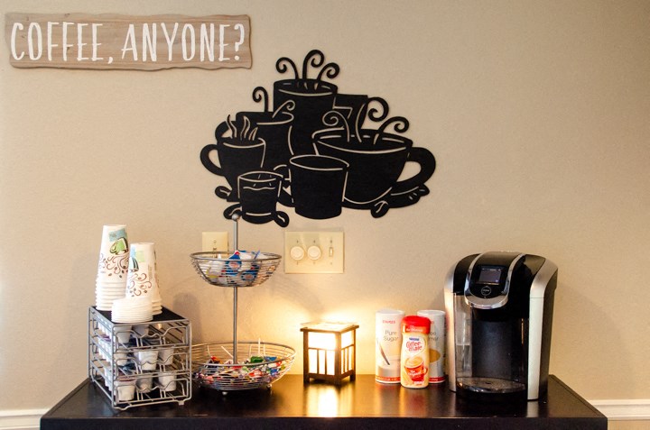 a coffee shop with coffee cups on the wall