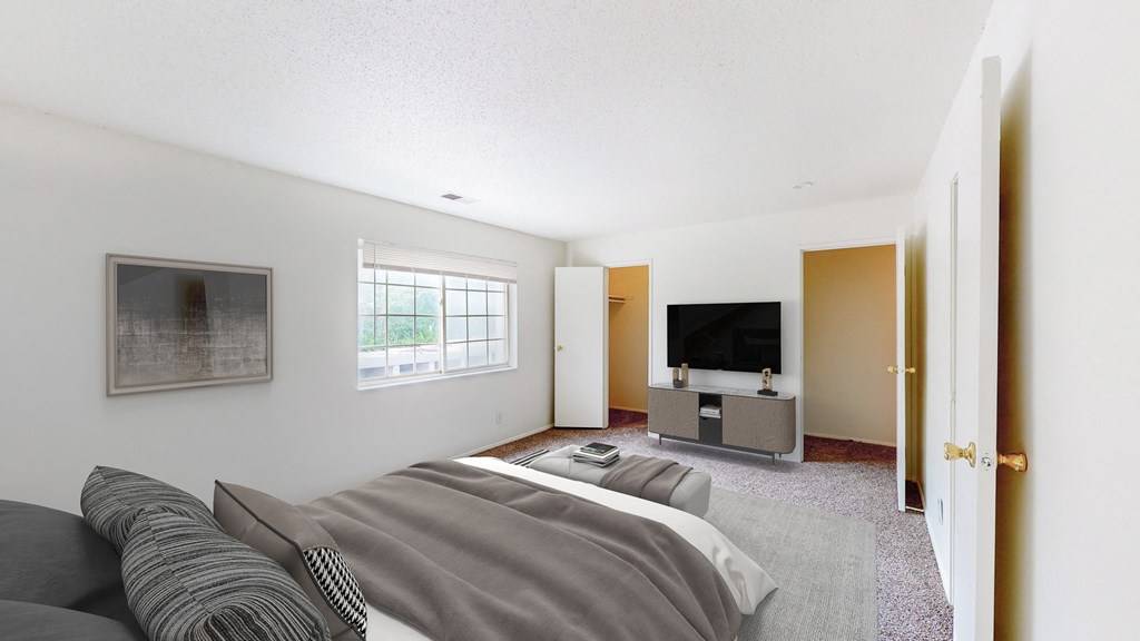 a living room with a couch and a tv