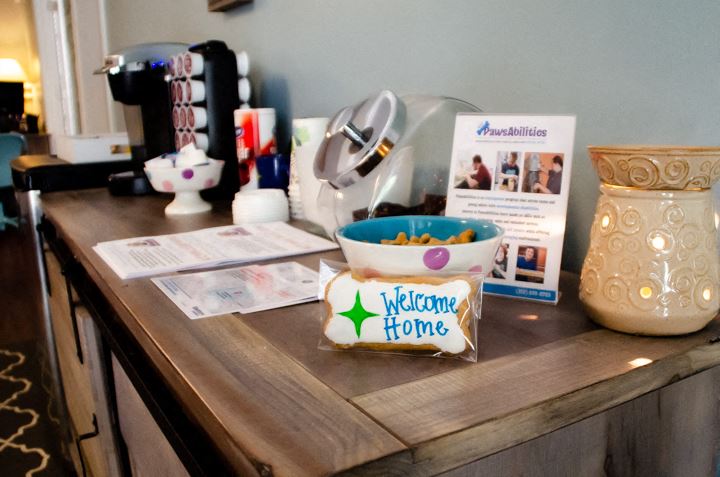 a kitchen counter with a bowl of cereal and a sign that says welcome home