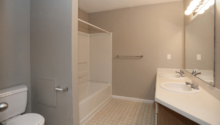 a bathroom with a sink toilet and a shower
