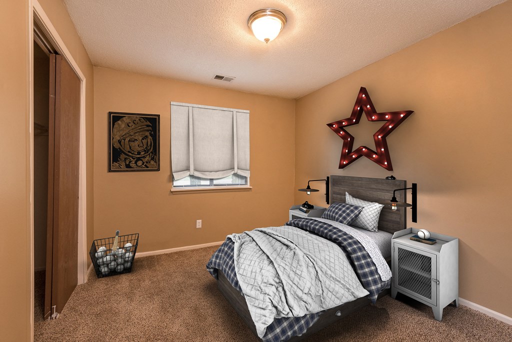 the master bedroom has a comfy bed and a window