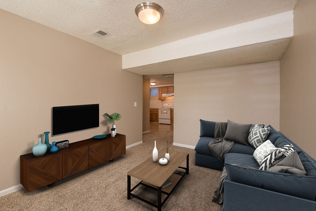 a living room with a couch and a tv