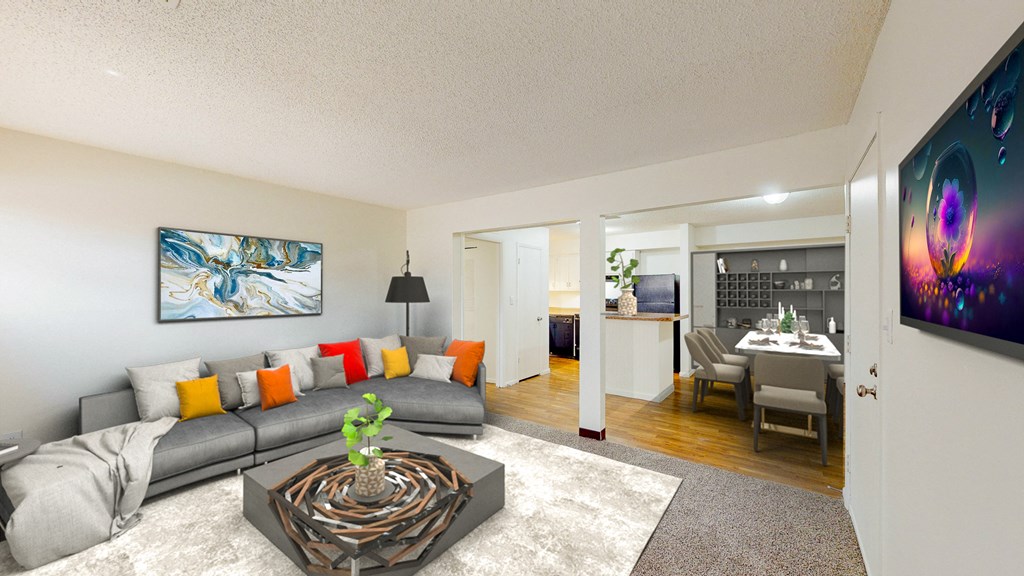 a living room with a gray couch and a coffee table