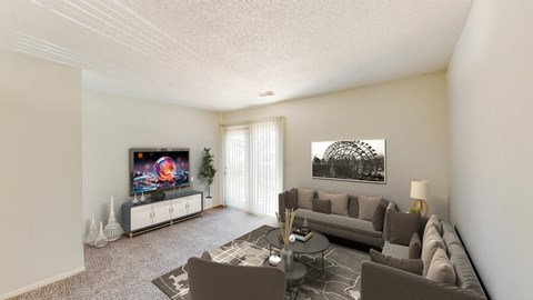 the living room of an apartment with couches and a tv
