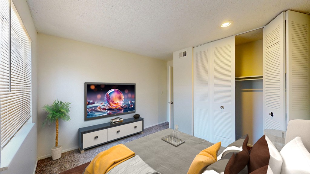 a living room with a couch and a tv