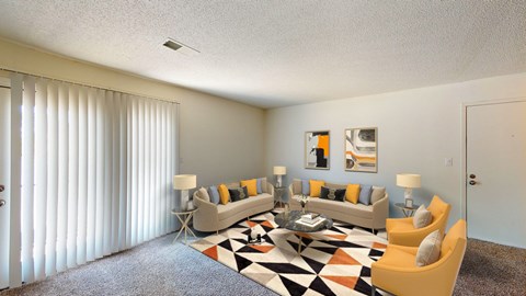 a living room with couches and a rug