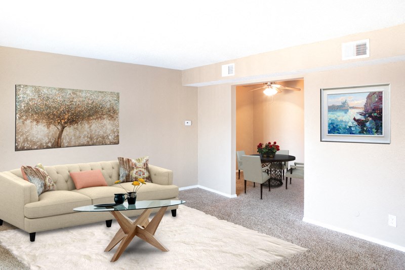 a living room with a couch and a table