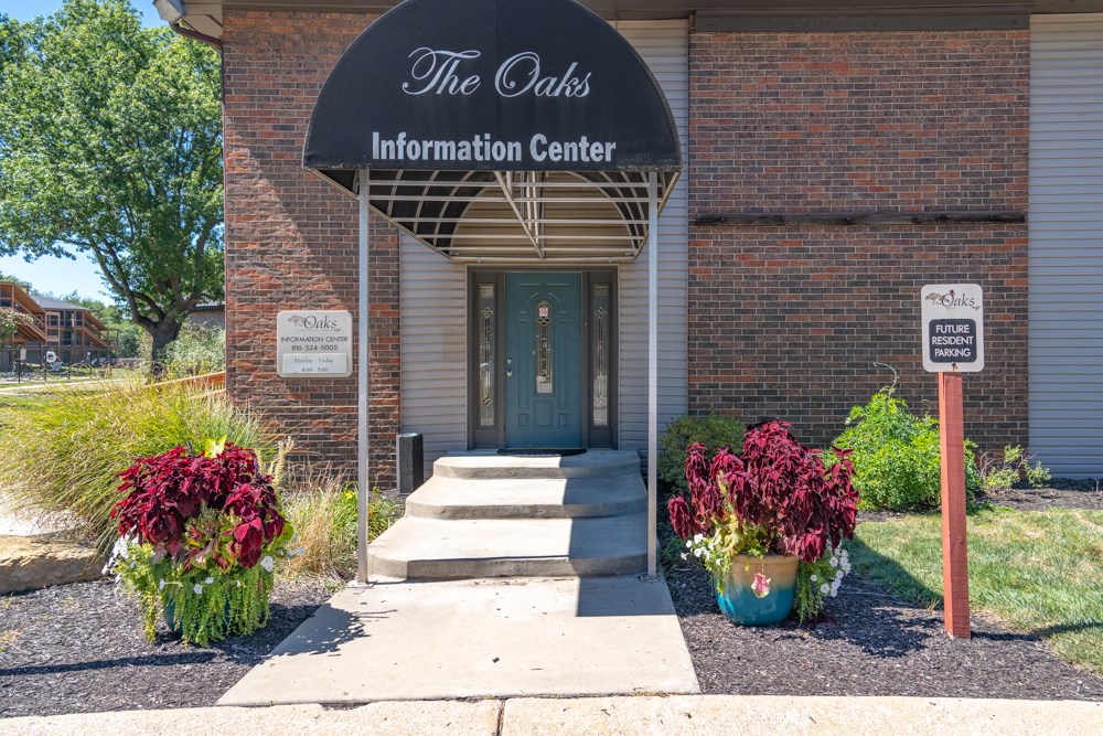 the facade of the crisis information center with a blue door and a black awn