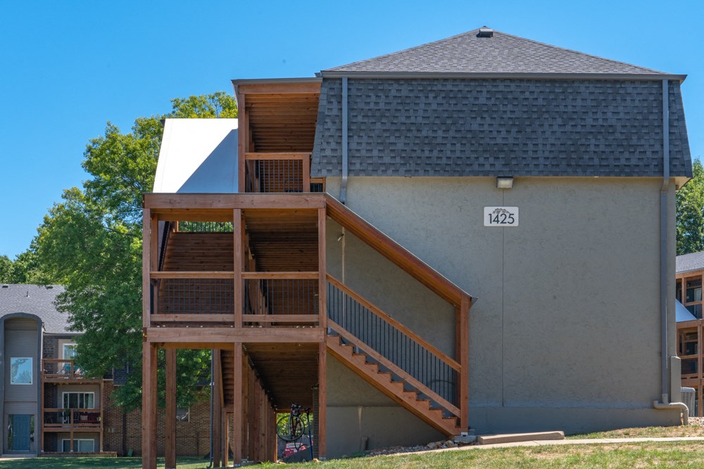 a house with a deck on the side of it