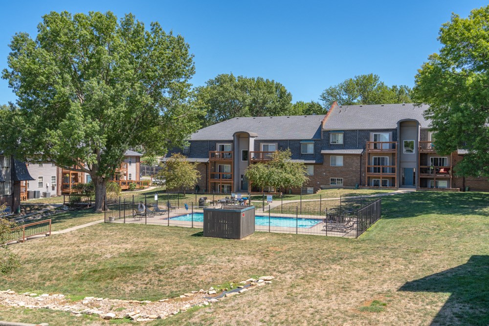 our apartments have a fenced in yard with a pool