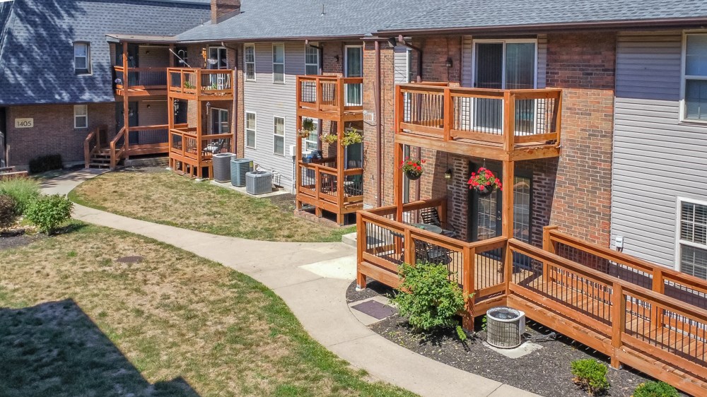 an aerial view of a building with wooden decks