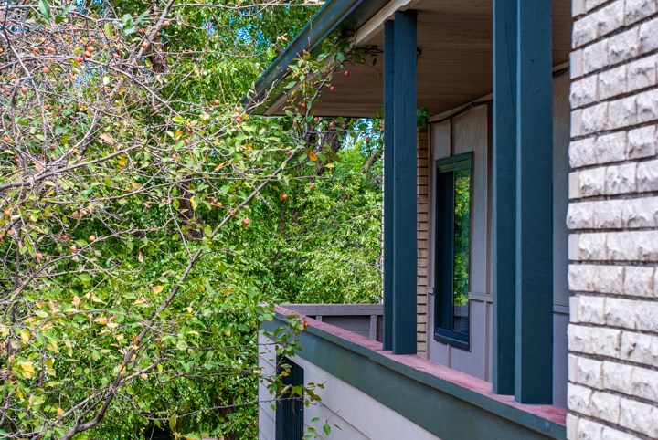 a view of the side of a house with an open window