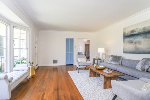 a living room with couches and chairs and a coffee table