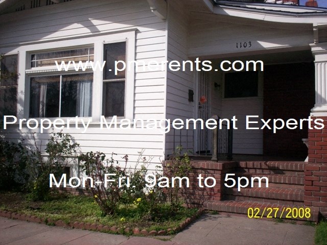 a view of the front of a house with a front porch