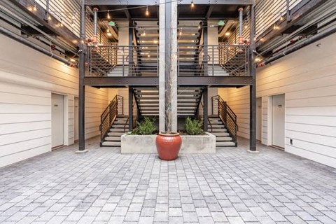 the lobby of a large building with stairs