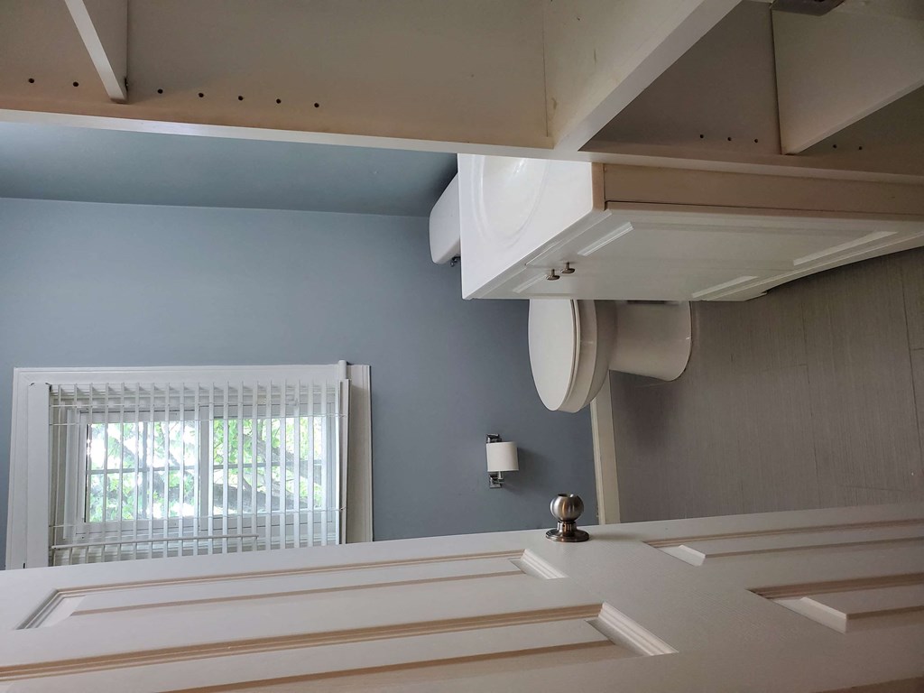 a view of a bathroom with a window and a sink