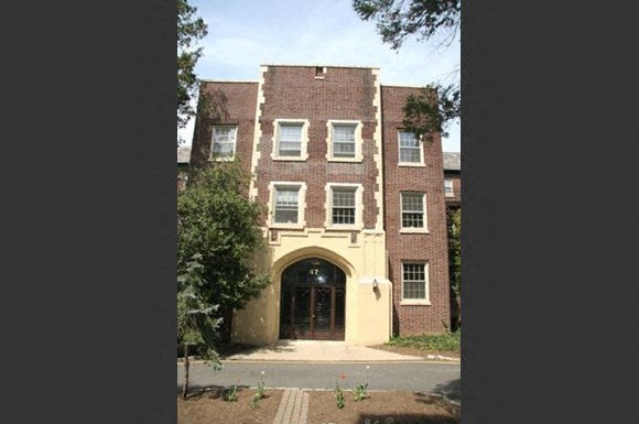 the front of a building with an arch doorway