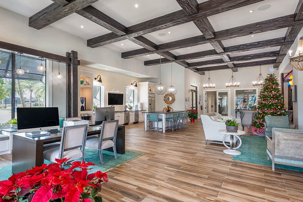 a living room with a christmas tree in the corner