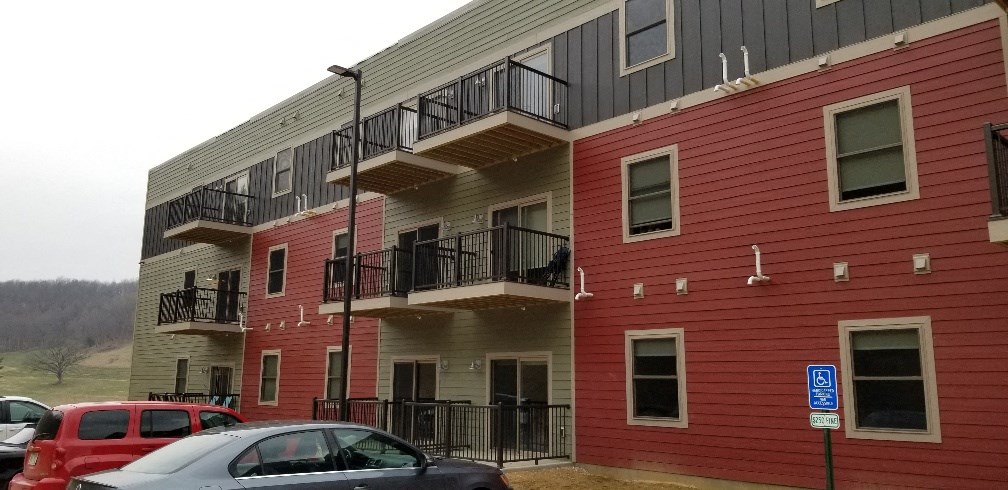 a red and white building with cars parked in front of it