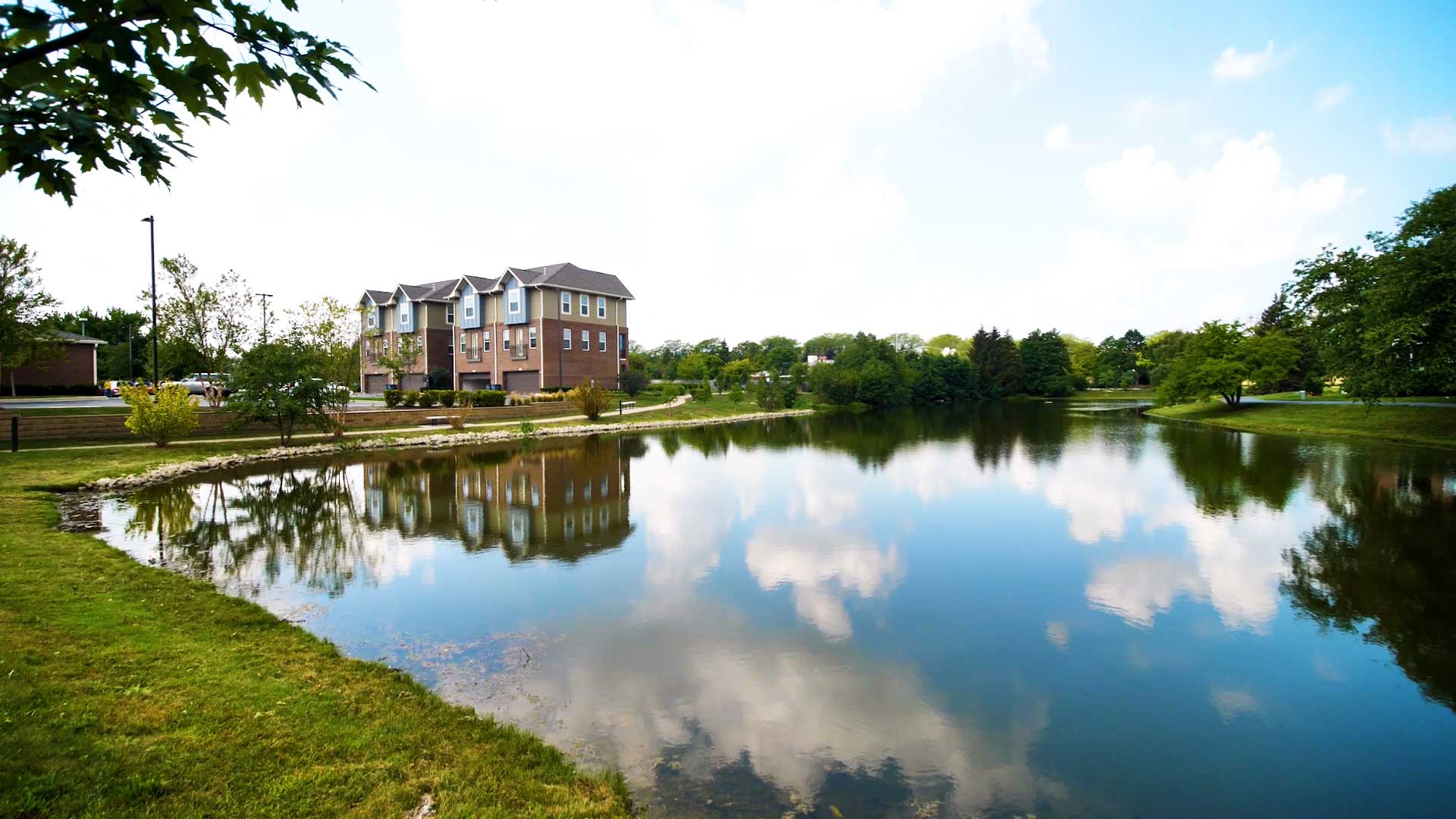 Looking across a pond next to North 680. The four townhouses of North 680 are seen on the left in the distance.
