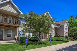 our apartments are located in the community with a sidewalk and green grass