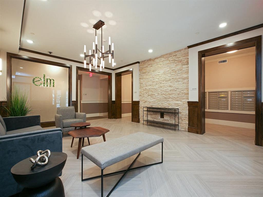 a lobby with a couch and a coffee table