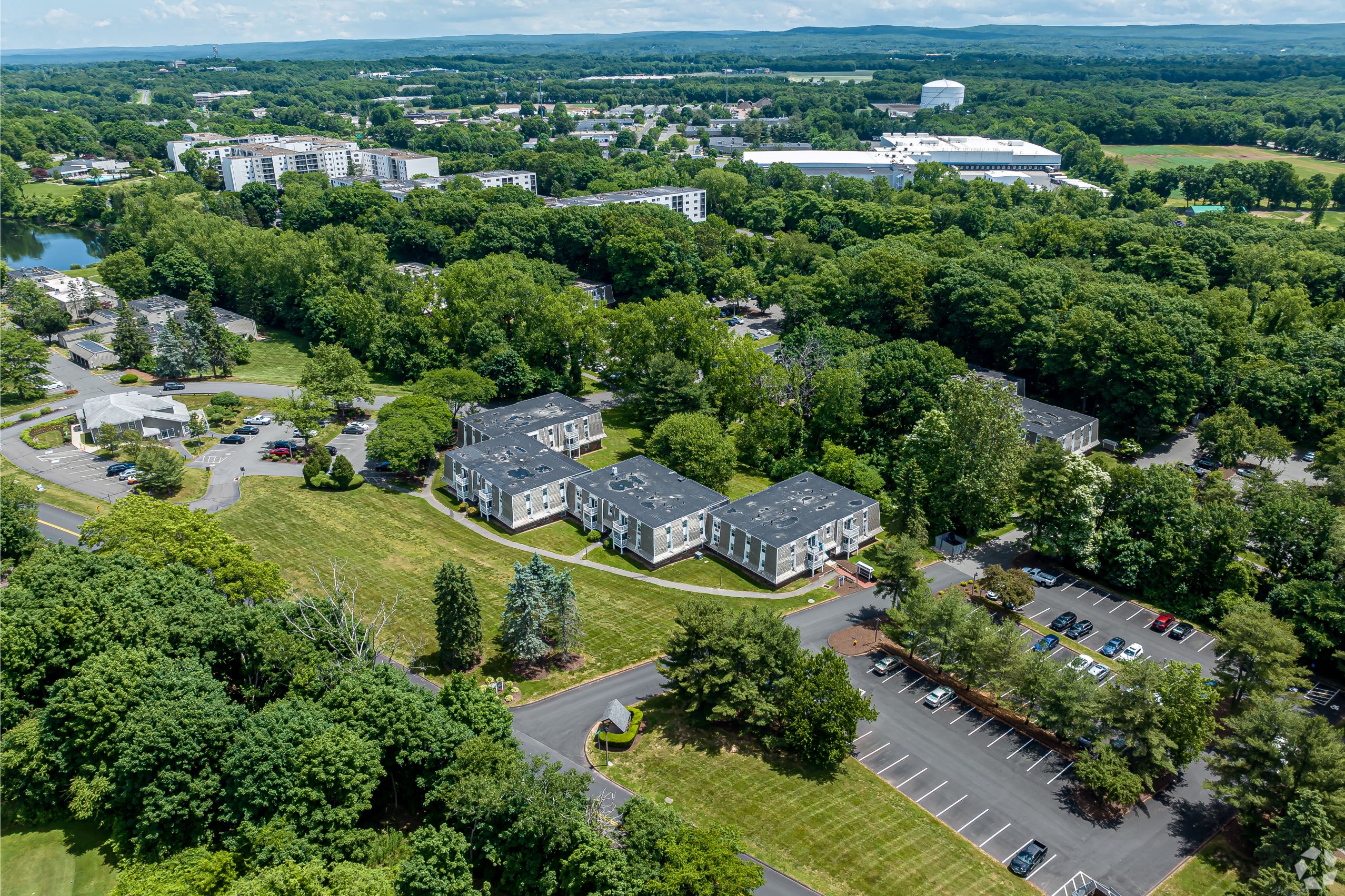 an aerial view of a city with houses and a park