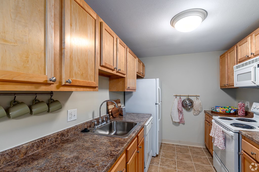 a kitchen with a sink and a refrigerator