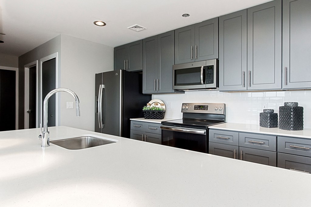a kitchen with a counter top and a sink