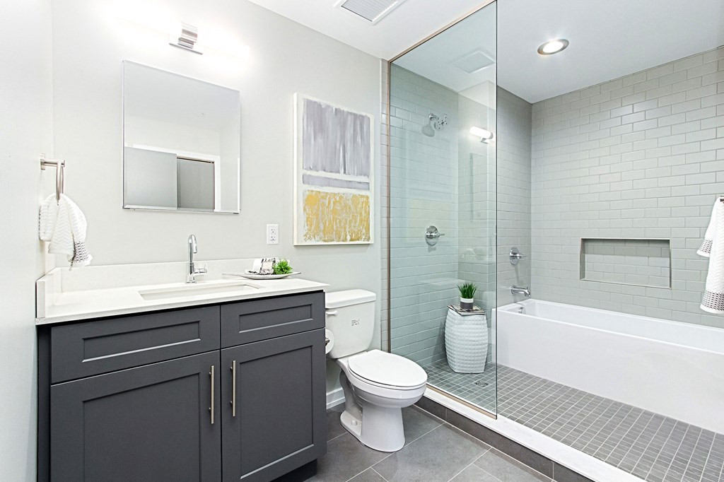 a bathroom with a sink toilet and a shower